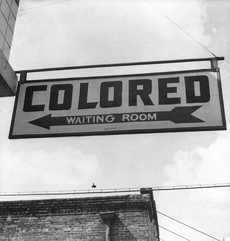 Sign with the words: “Colored Waiting Room”.